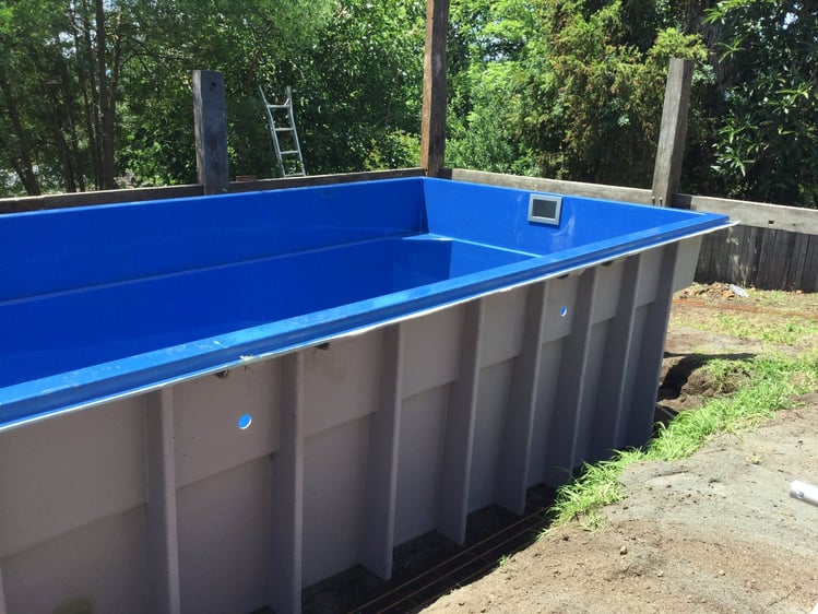 Above ground pool during pool installation with extra support ribs